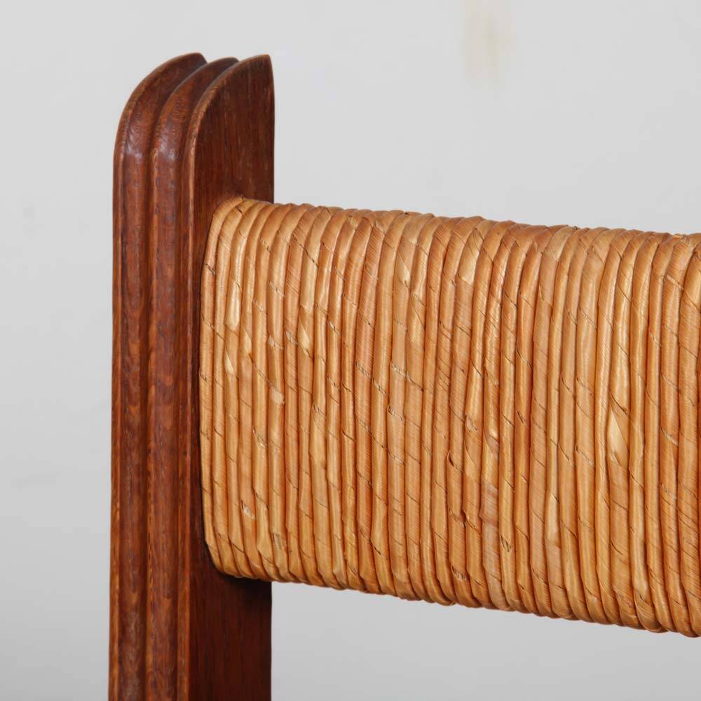 Pair of oak straw-seated armchairs from the 1950s.