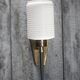 Brass wall light, black lacquered metal and white opal glass, 50s.