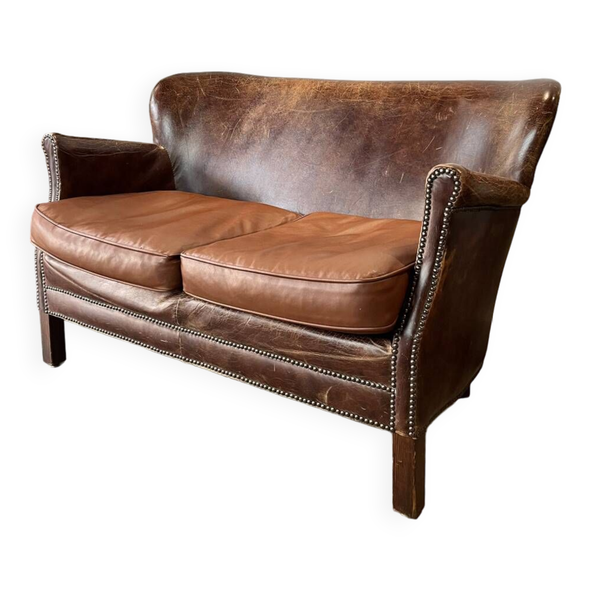 Banquette vintage en cuir clouté