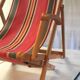 Vintage deck chair in wood and striped fabric - mid-20th century