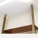 Tension pole free standing rose gold aluminum Omni wall unit by George Nelson