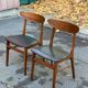 2 Scandinavian chairs in teak and black imitation leather, 1960s