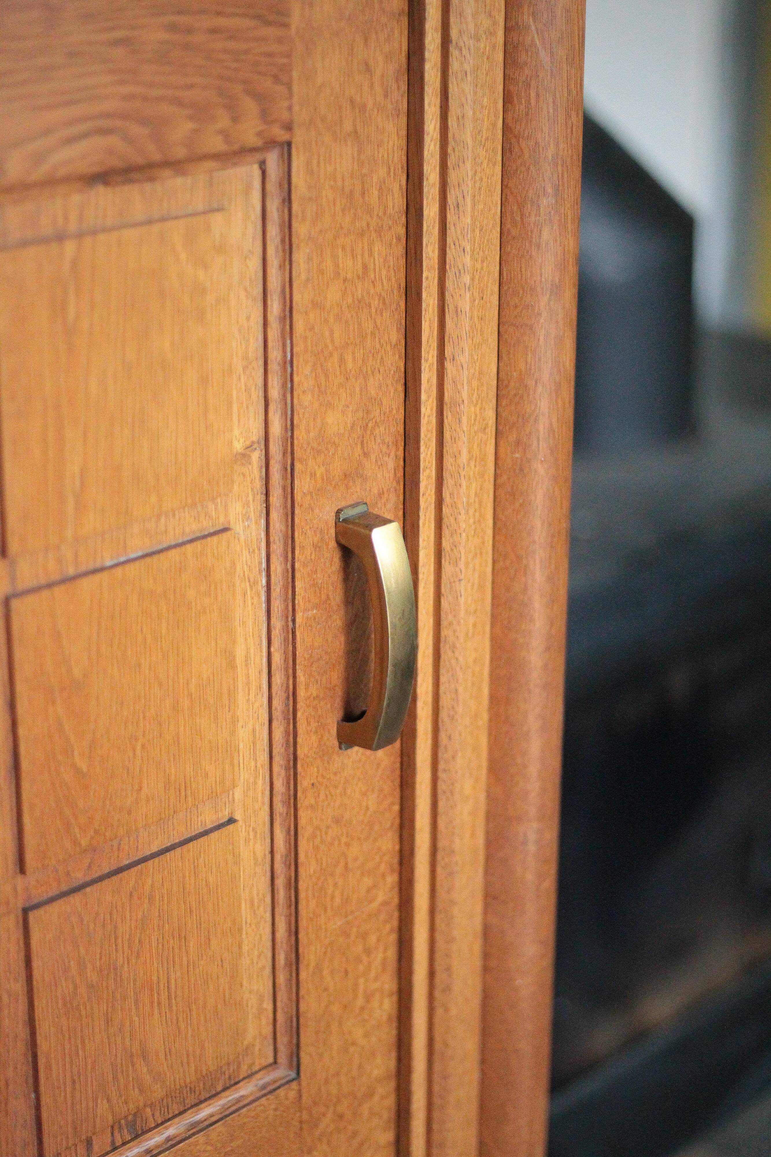 Vintage wooden wardrobe with sliding doors.
