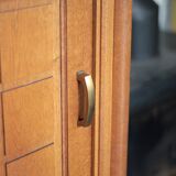 Vintage wooden wardrobe with sliding doors.