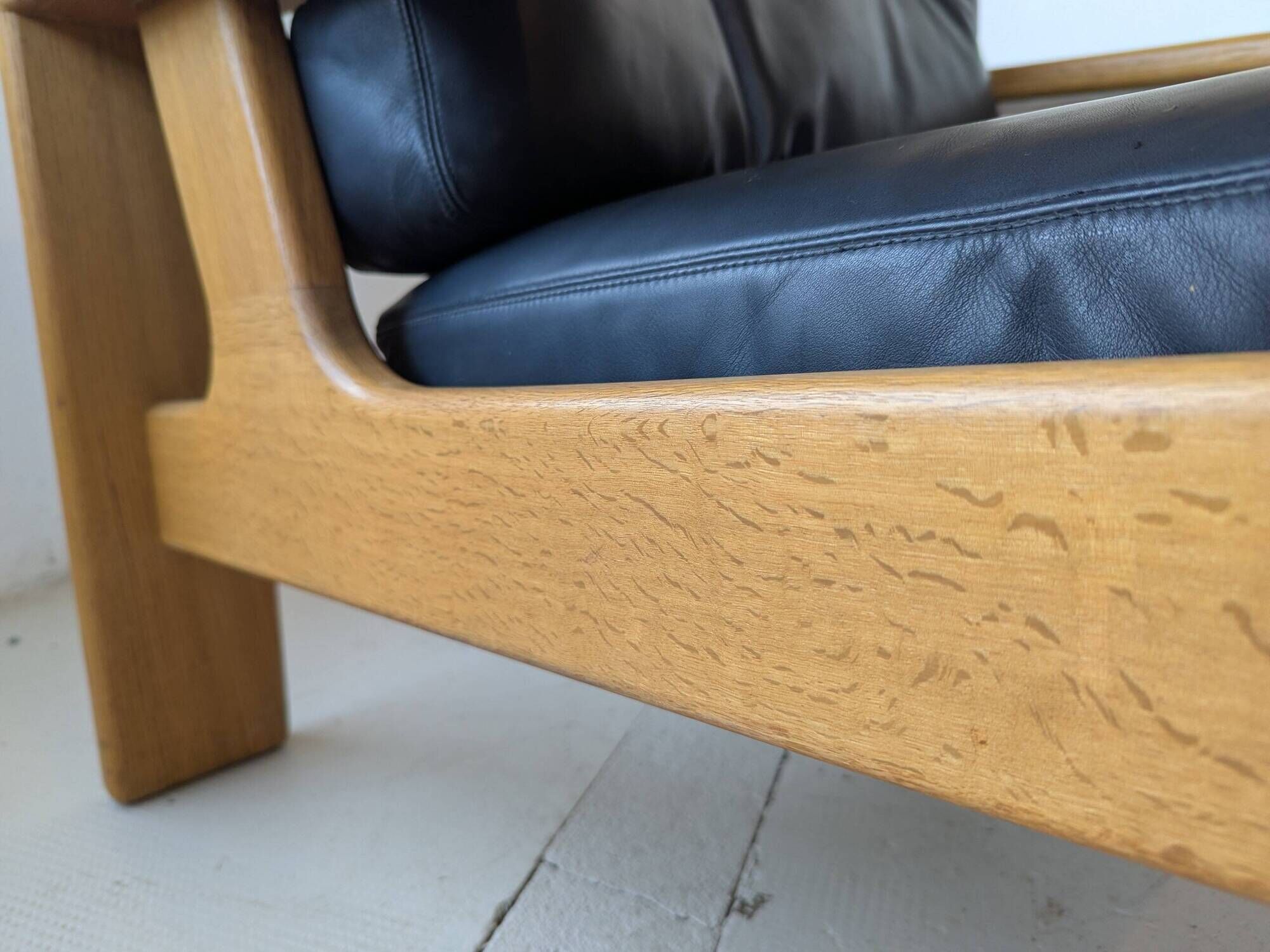 Pair of raw oak and leather armchairs by Esko Pajamies for Asko, Finland.