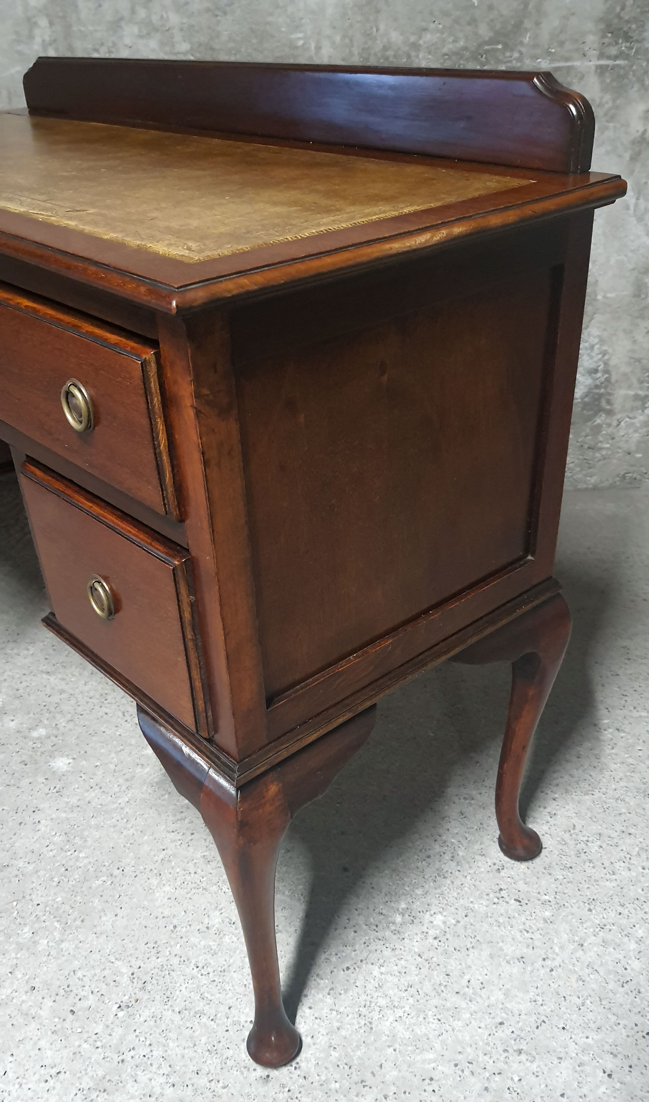 Old desk in cherry and green leather