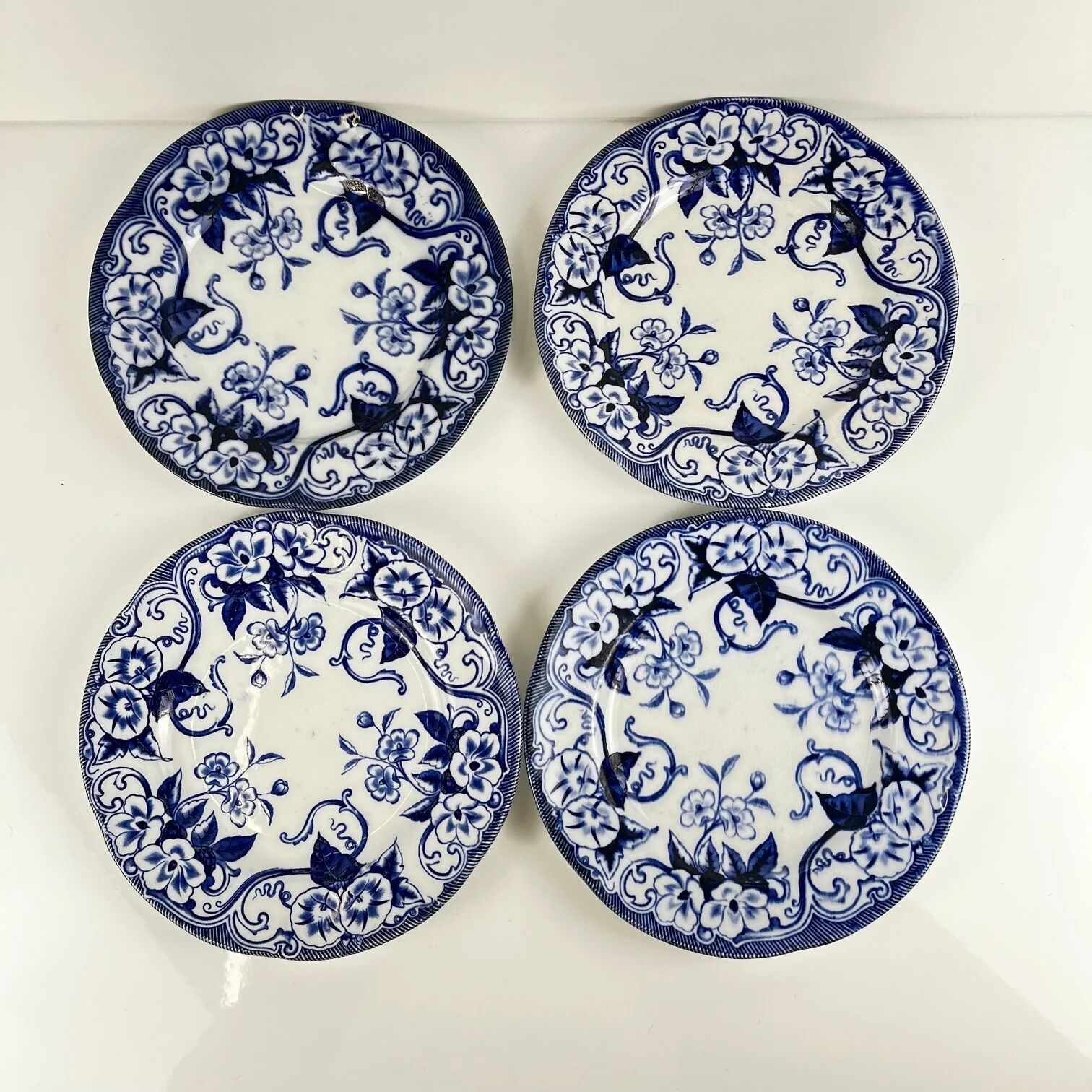 Set of 4 dessert plates in ironstone "Flora" – Creil and Montereau, 19th century, blue