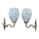 Pair of brass wall lights and glass paste.