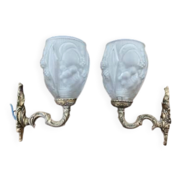 Pair of brass wall lights and glass paste.