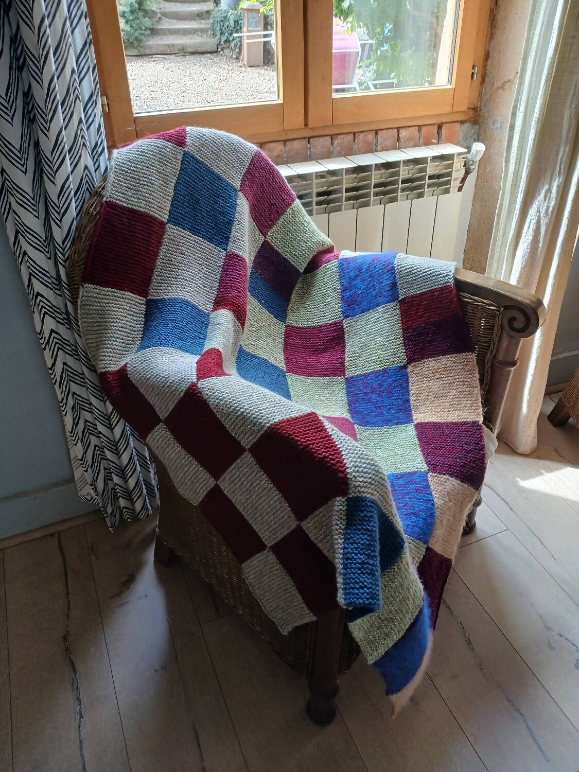 Hand knitted patchwork plaid