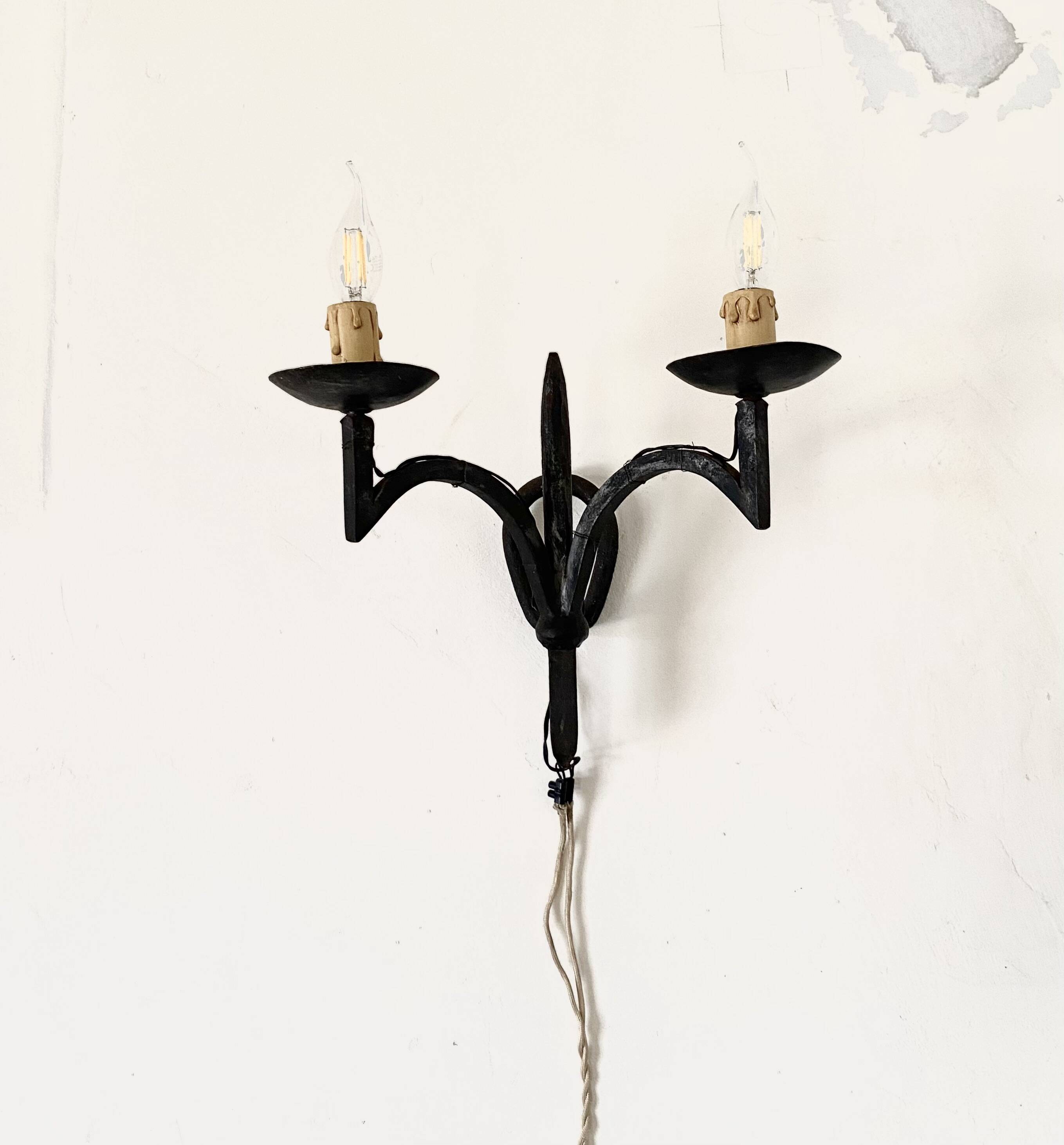 Wrought iron wall lights.