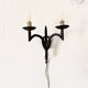 Wrought iron wall lights.