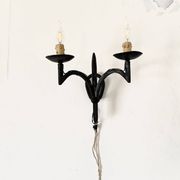 Wrought iron wall lights.