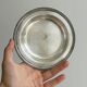 Round patinated silver-plated metal dish