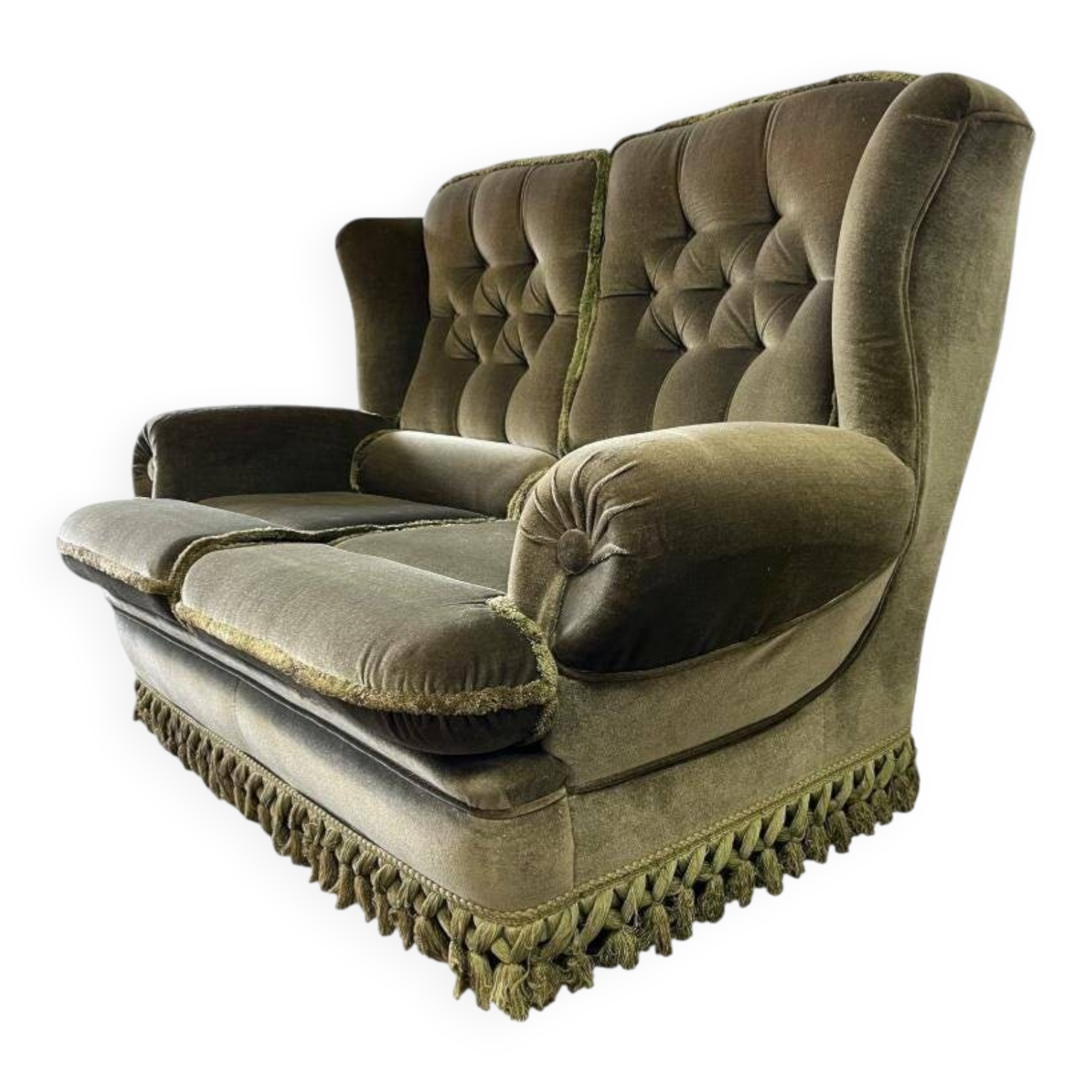 Vintage green two-seater sofa with fringes
