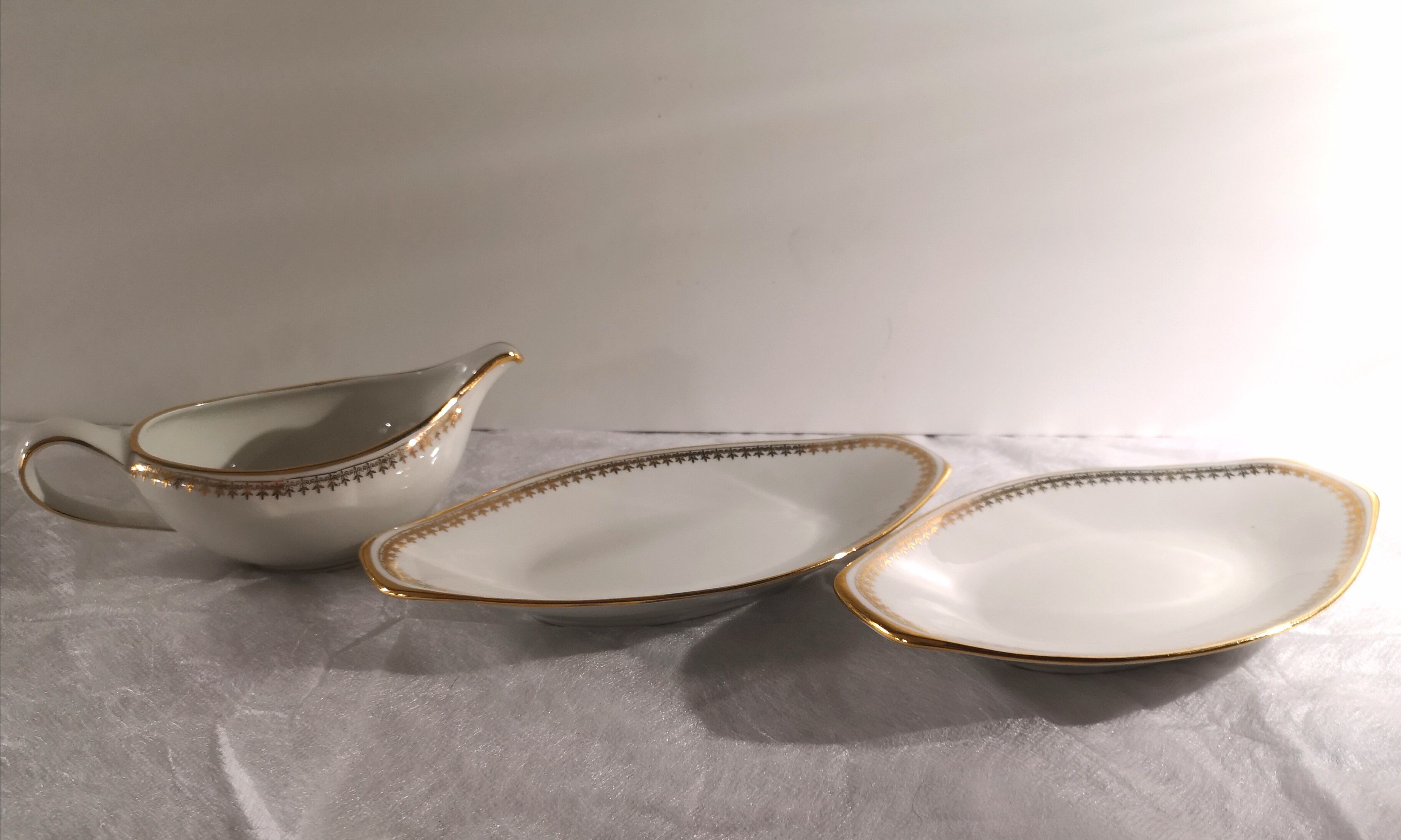 Gravy boat and dishes with gold decoration
