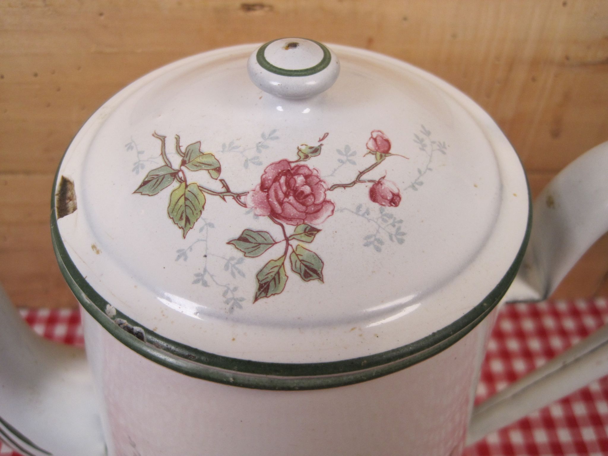 Old coffee maker in enamelled sheet metal brand bb 1900s , decoration of roses , kitchen utensils