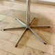 Dining table with a star-shaped six-legged base by Arne Jacobsen for Fritz Hansen.