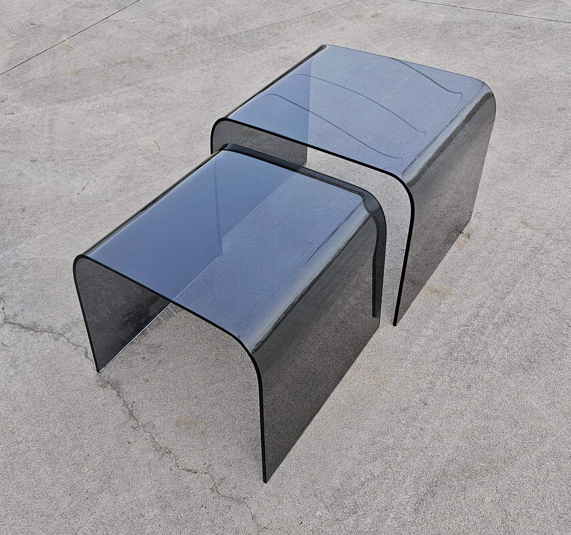 Pair of Waterfall nesting tables in tinted glass attributed to FIAM 1980s.