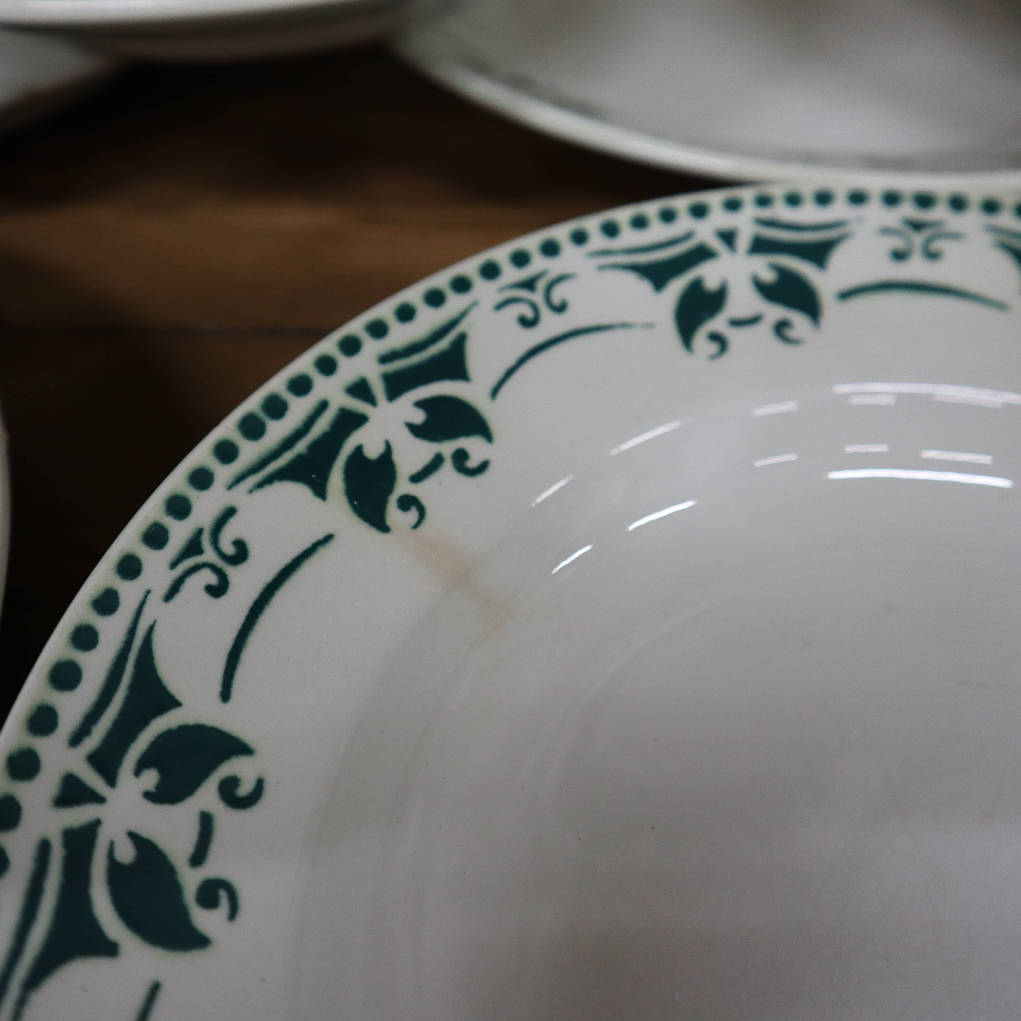 11 white and green earthenware soup plates from Saint Amand Terre de Fer