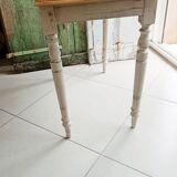 Antique wooden desk with a patinated base