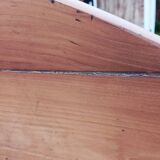 Oval table of grape harvesters from the Southwest in cherry wood