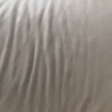 2 seater leather sofa in off-white with a rounded shape