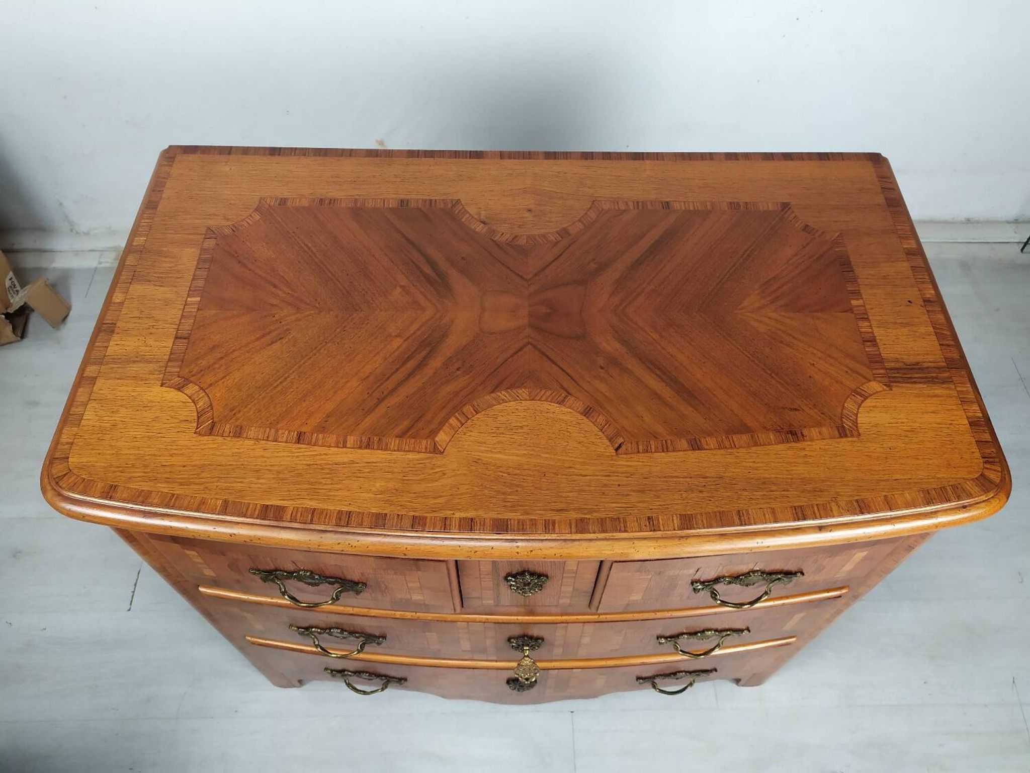 Marquetry style chest of drawers