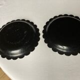 Two undersides of Napoleon III bottles in boiled cardboard