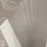 Pair of Art Deco wall sconces in plaster and pressed glass.