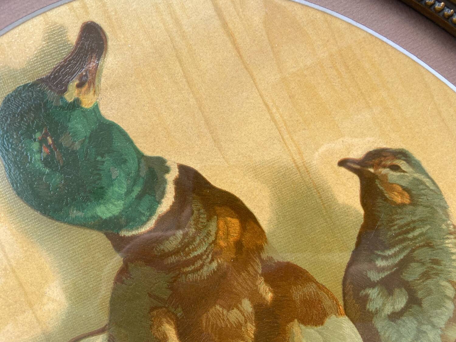 Antique oval frame with an oil painting of green collars