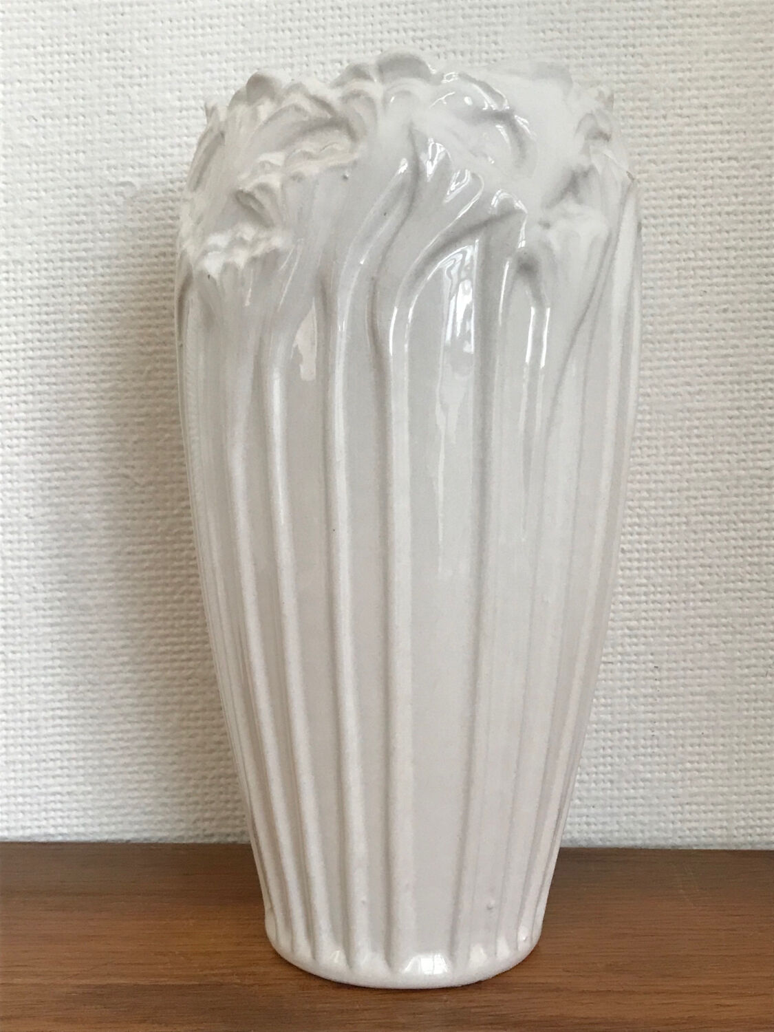 Old white art nouveau vase with flowers and dragonflies