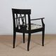 Bridge armchair in wood and leather, work from the early 20th century.