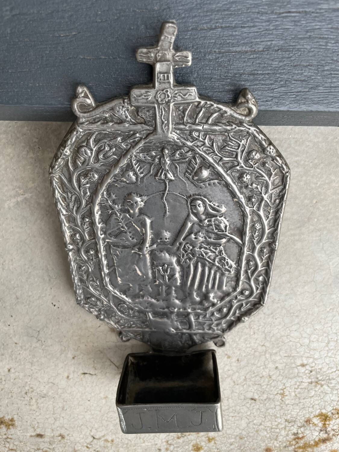 Small wall-mounted holy water font