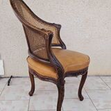 Fauteuil de bureau louis xv, sculpté, canné, garni cuir