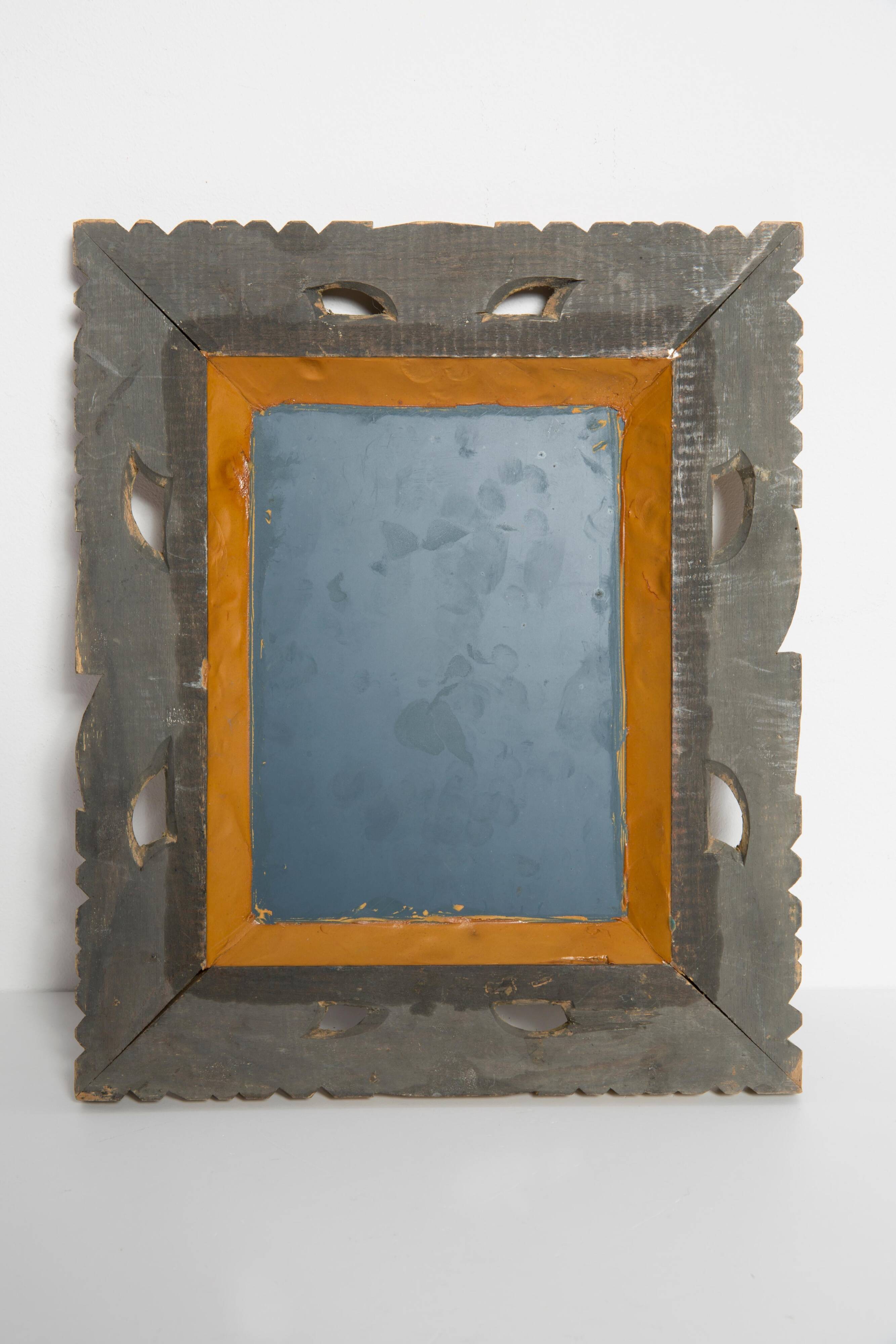 Decorative gold mirror mid-century in a wooden frame, Italy, 1960s.