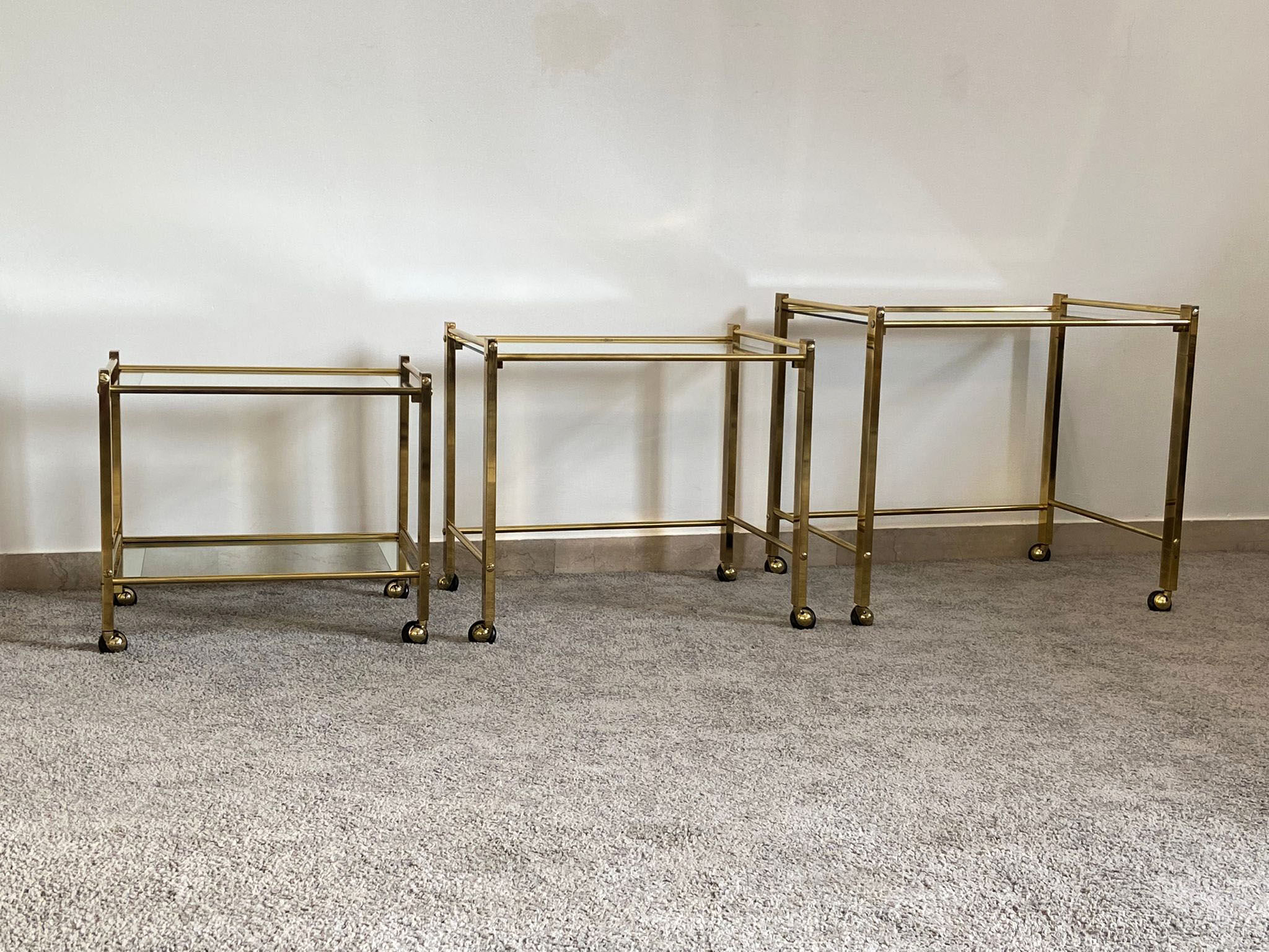 Trio of coffee tables "Nido" brass and glass Italy 70s