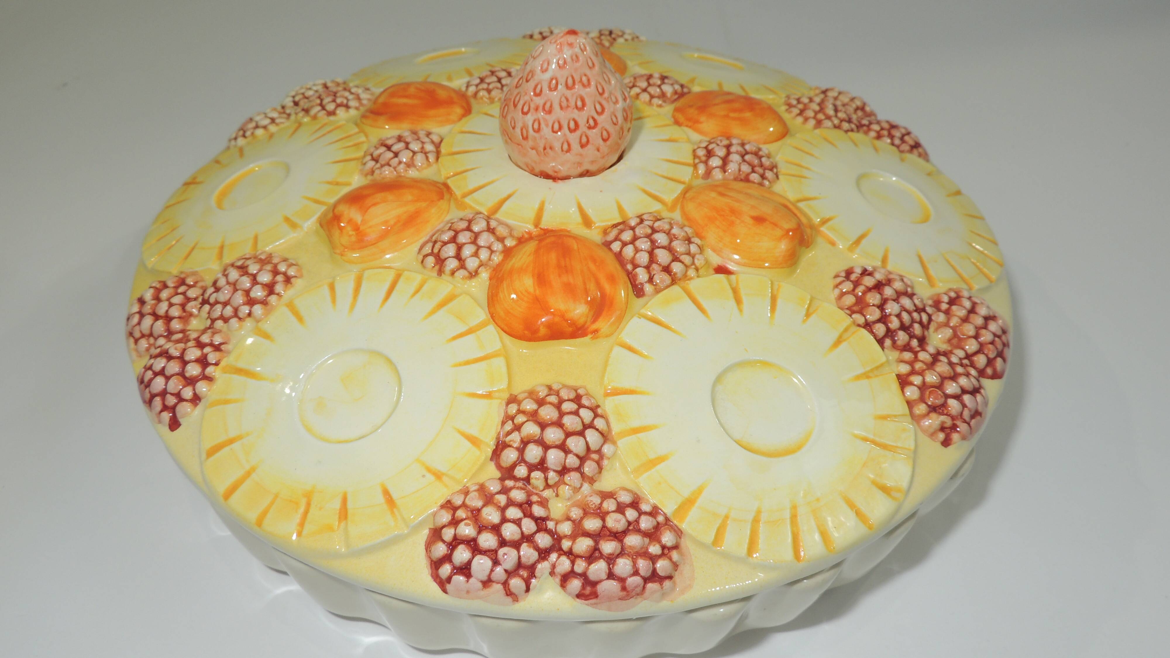 Magnificent fruit tart dish in slip signed "What's Vincent Cadeaux