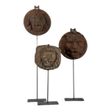 Three cast-iron and terracotta façade decoration lions, around 1880.
