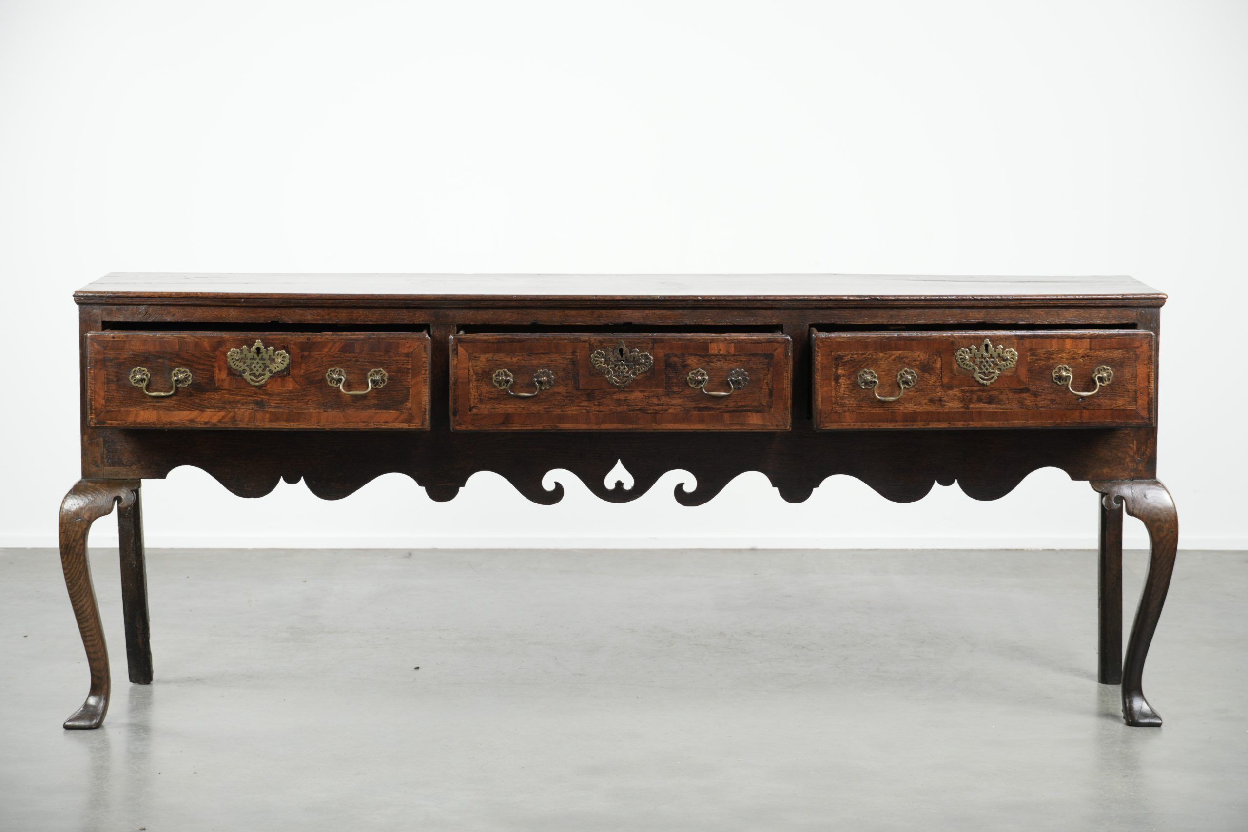 Large antique English oak sideboard from the 18th century with elegant legs