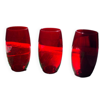 3 red olive-shaped glasses