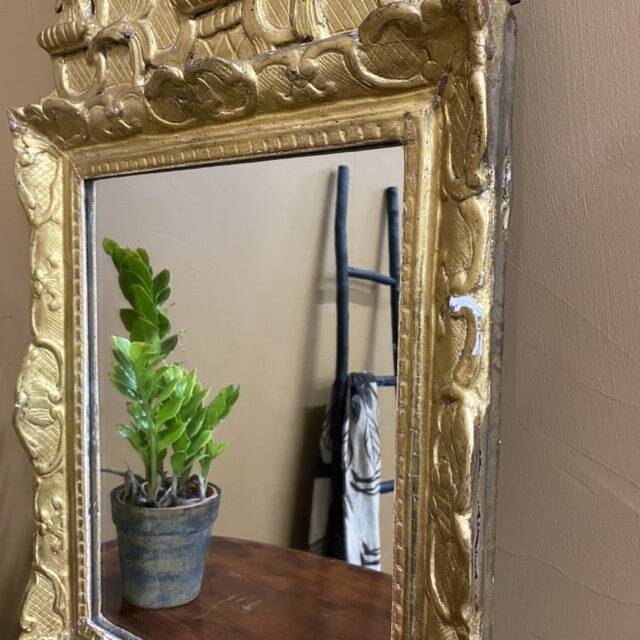 Small antique mirror in gilded wood, regency style