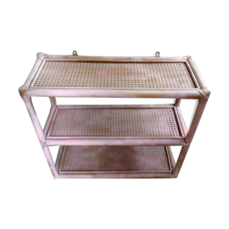 Pink rattan and cane shelf