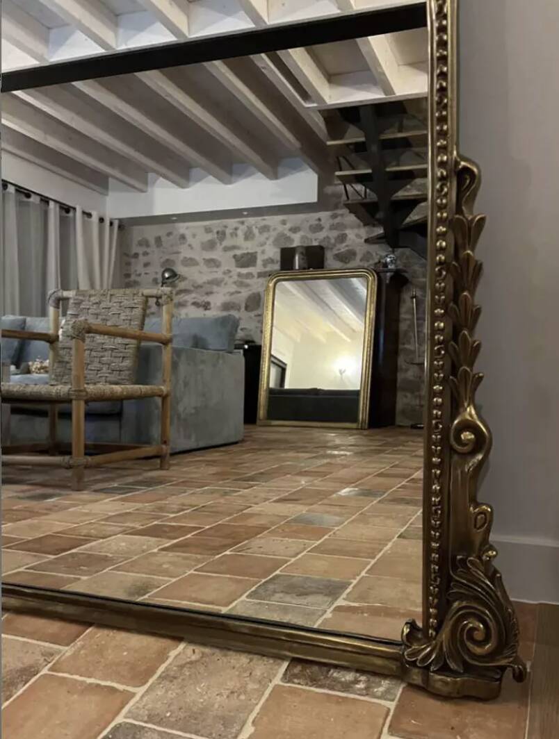 Large gilded mirror with pediment