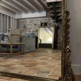 Large gilded mirror with pediment
