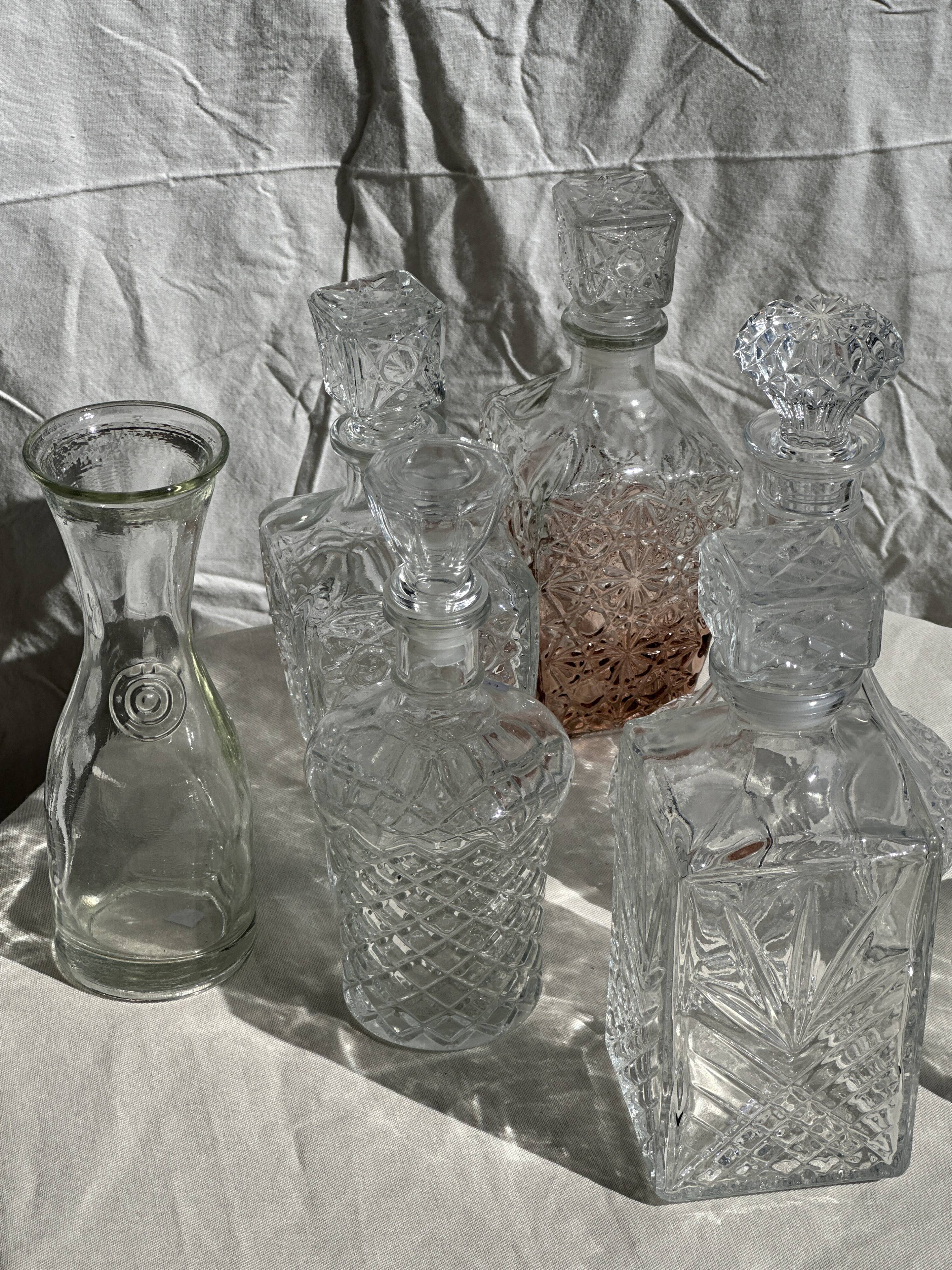 Small cylindrical glass whiskey decanter H:23