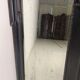 Late 19th century ebonised mirror with original foxed glass