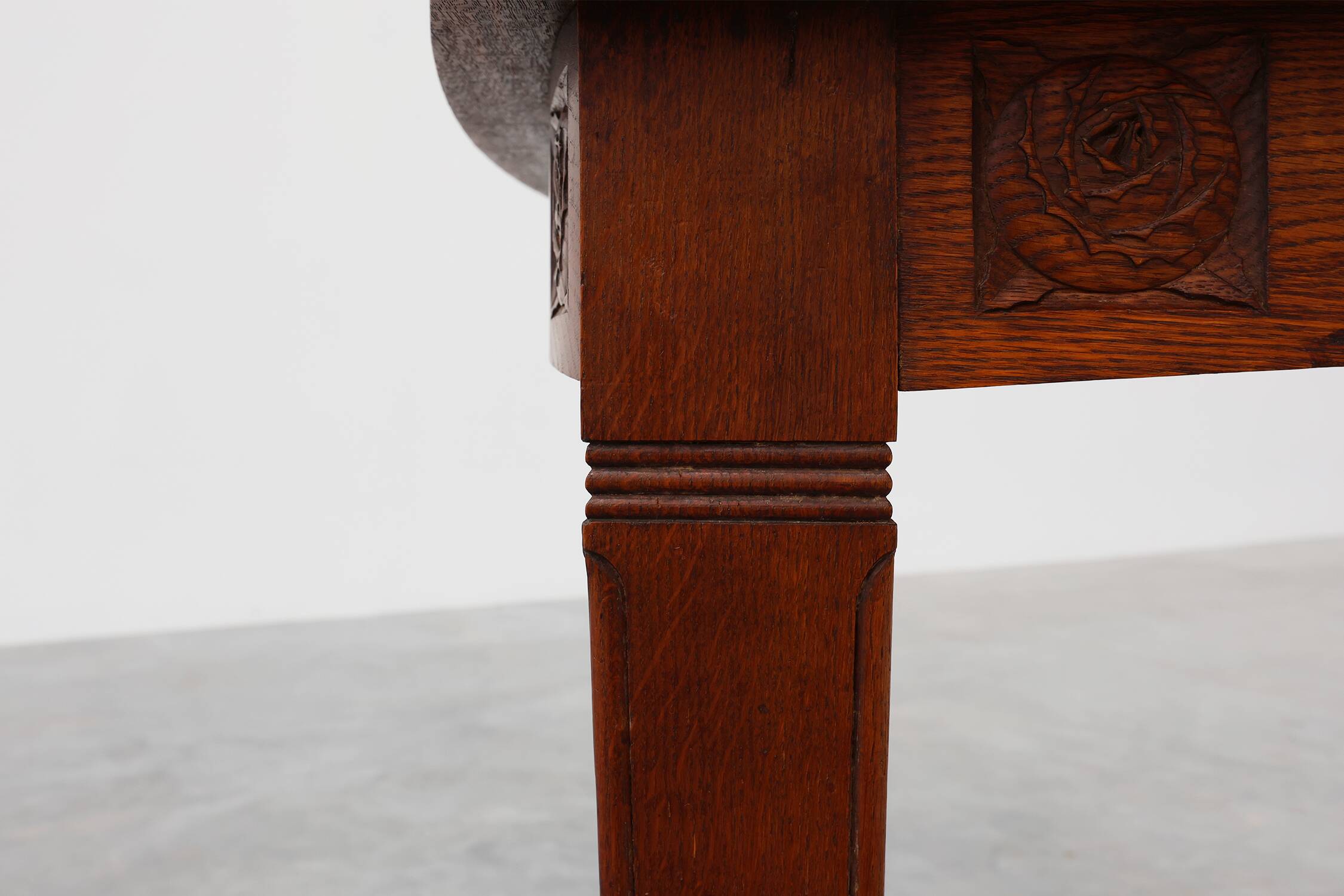 Oak Art Deco dining table with carved frieze, France 1920s