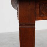 Oak Art Deco dining table with carved frieze, France 1920s