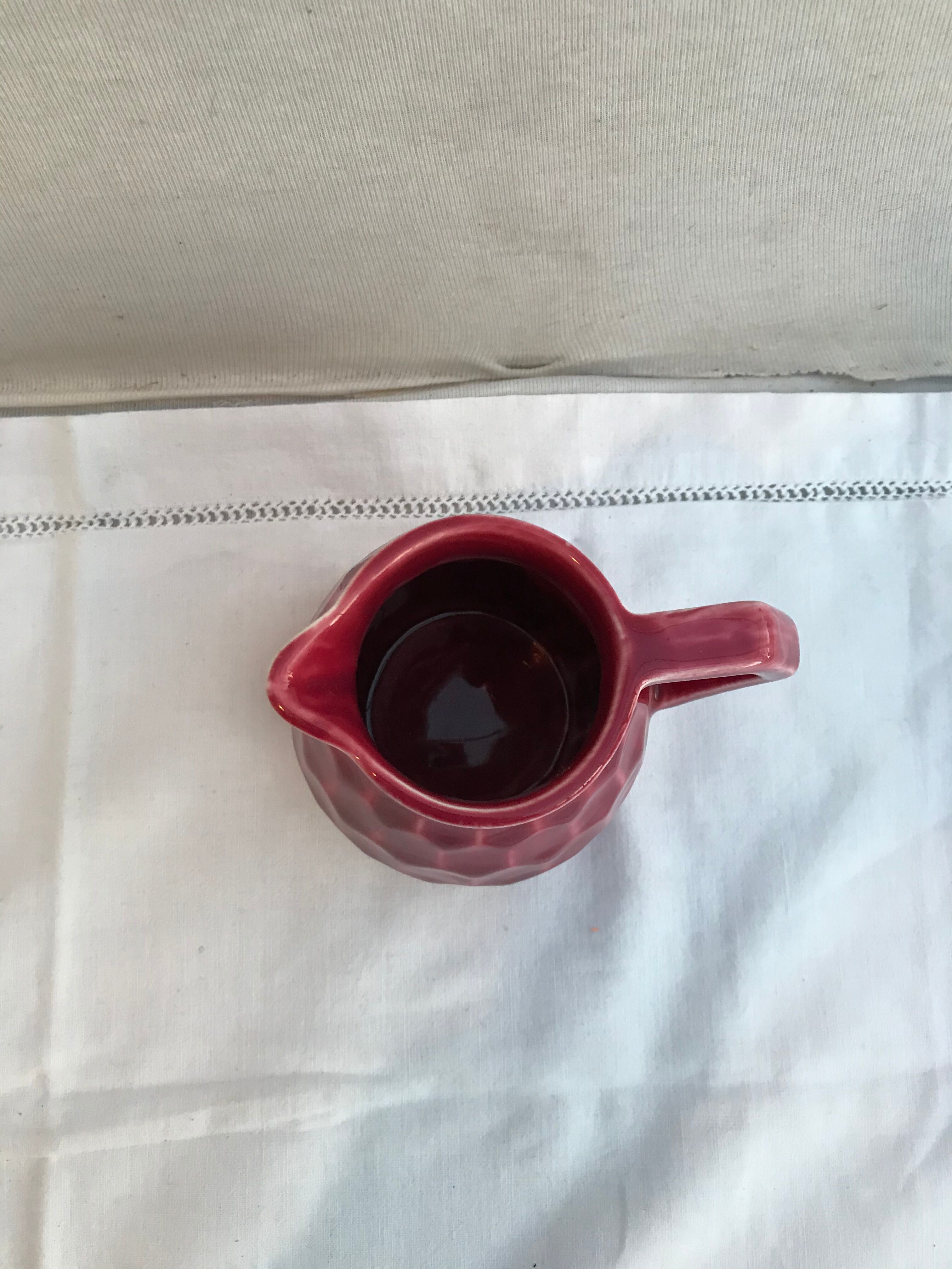 Former art deco red ceramics pitcher